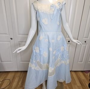 Elegant Light Blue Dress with White Floral Accents